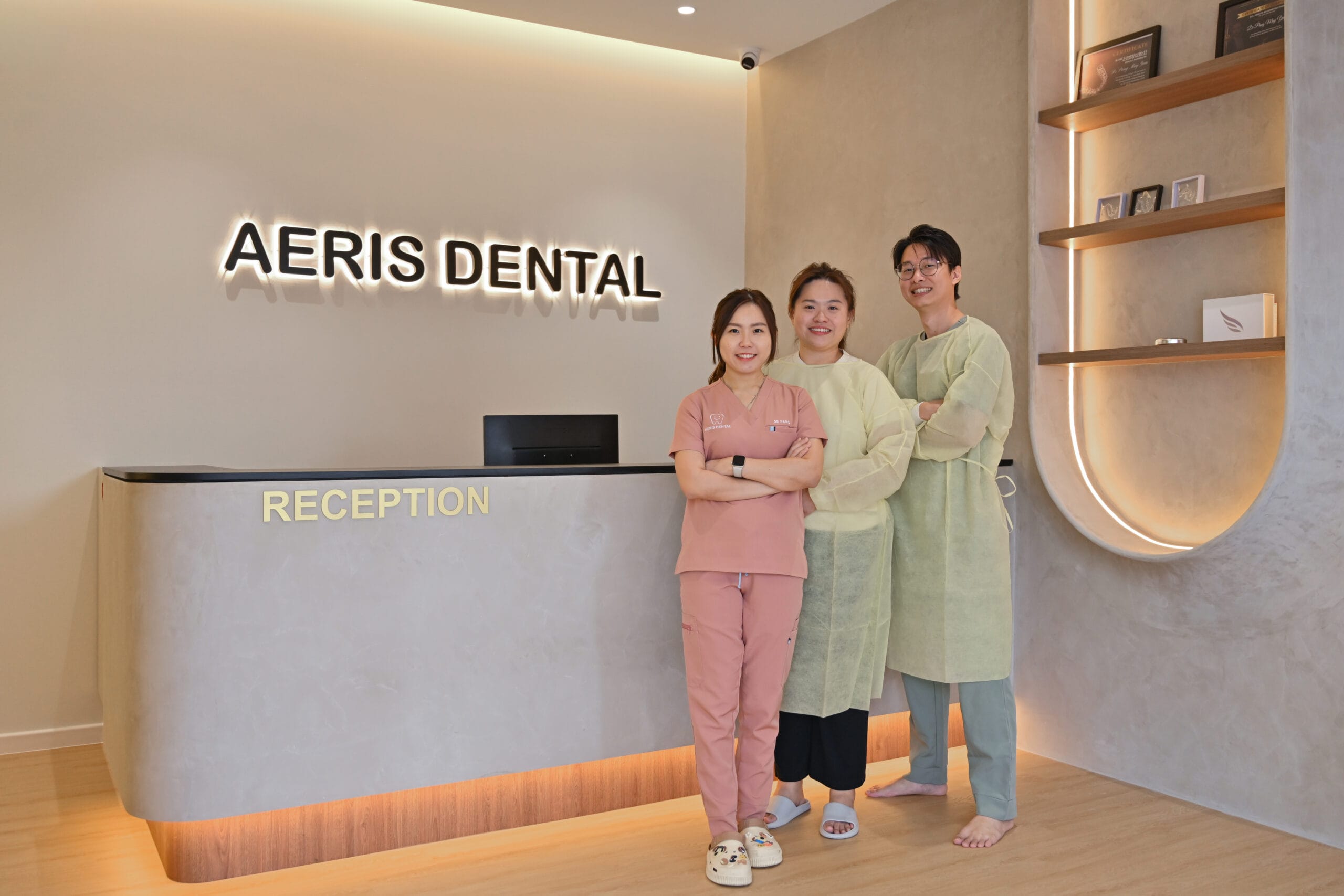 Aeris Dental team of dentists and dental assistants smiling at the clinic in Bandar Puteri Puchong.